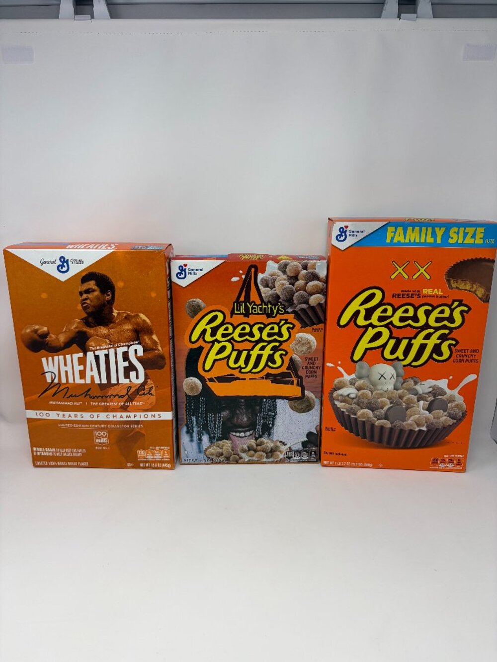 Wheaties Muhammad Ali & Reese's Puffs Lil Yachty's & Kaws Sealed Cereal Boxes GM